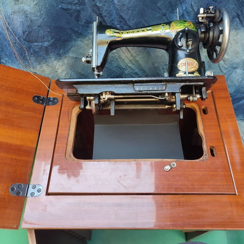 Patra sewing machine like new, treadle with furniture