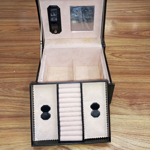 Vintage black jewelry box used with mirror and beige lining
