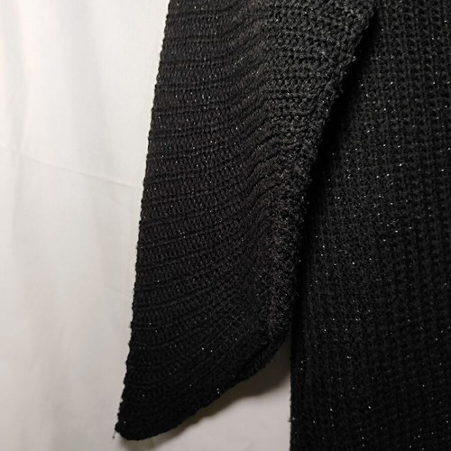 Black knitted sweater used with shiny detail and asymmetric sleeves size XL