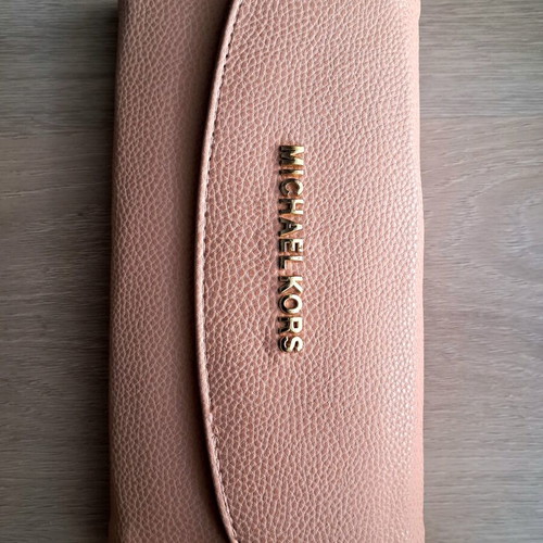 Michael Kors pink leather wallet like new with gold letters