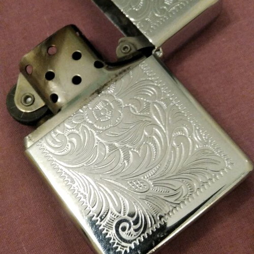 Zippo lighter collectible like new, silver with engravings