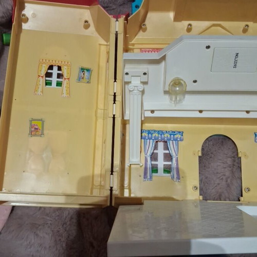 Vintage toy house with light used in good condition