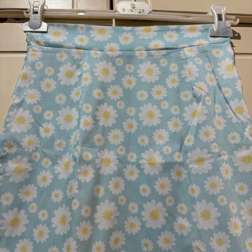 Mini skirt with daisies on blue background, size S, like new