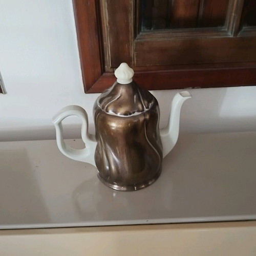 Vintage teapot used, ceramic porcelain with metal silver-plated holder