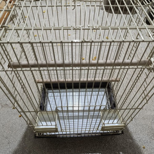 Large metal bird cage like new, with wooden perches and feeders