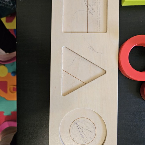 Hape shape puzzle used with marks from small hands