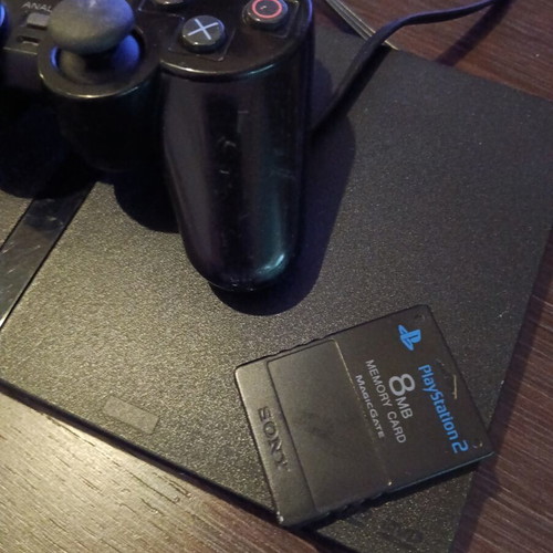 Sony PlayStation 2 console with memory card and remote
