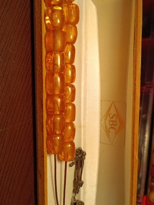 Handmade komboloi with amber-colored incense beads and silver finish, new