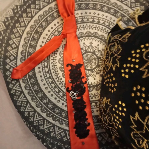 Red tie like new with pearls