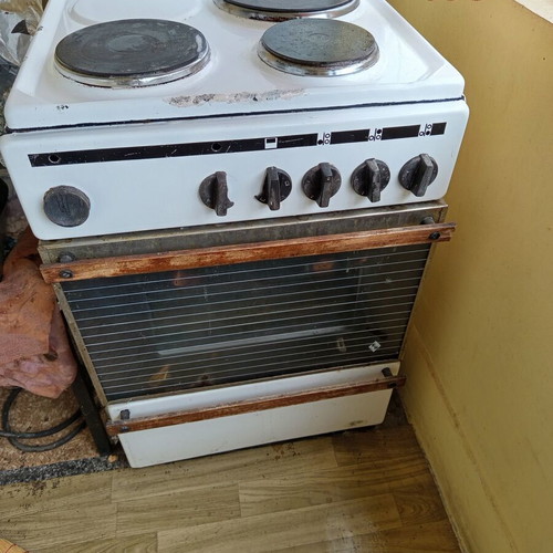 Stove used, burners work, oven heats slowly