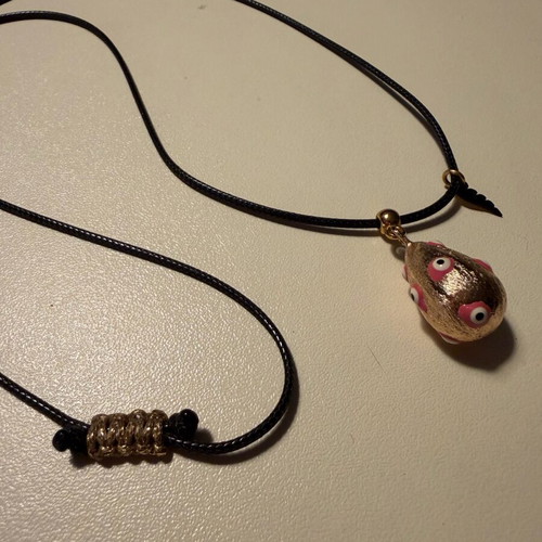 Easter egg pendant like new with leather cord