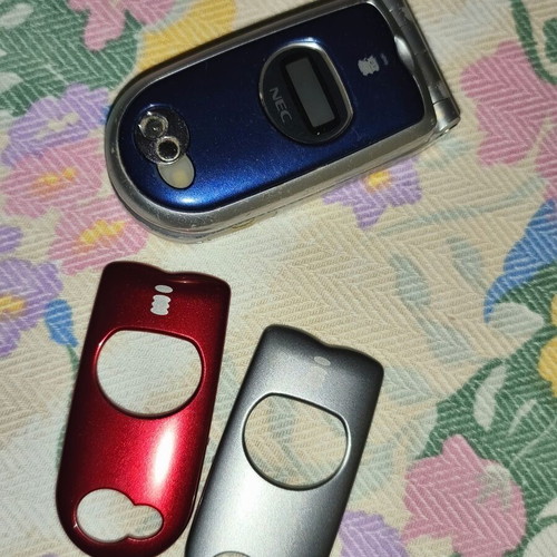 Nec mobile phone used with extra covers, collectible