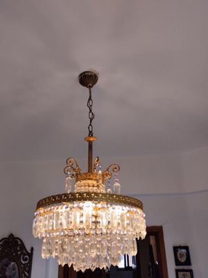 Old brass chandelier with crystals used, functional