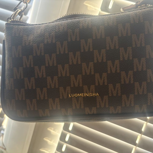 Brown crossbody bag like new with charm flower