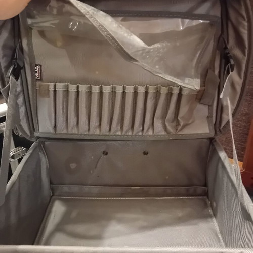 Suitcase fabric wheeled used with compartments for makeup organization