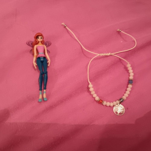 Doll like new with gift bracelet