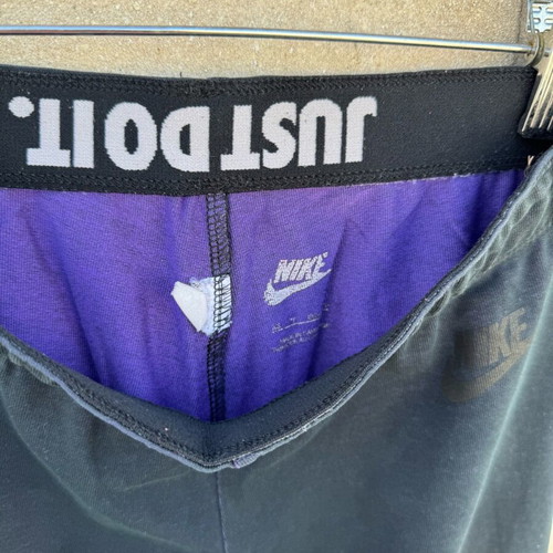 Nike legging used with knee defect, black and purple, size S