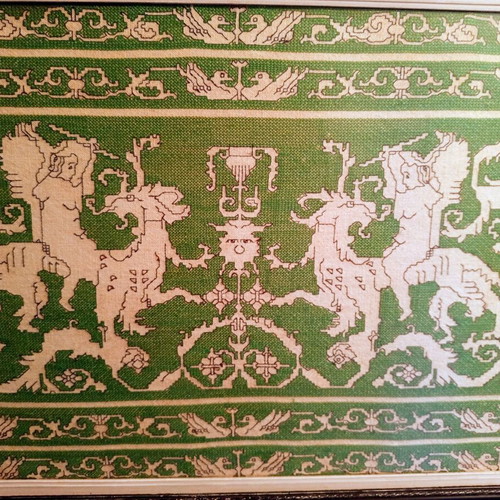 Handmade embroidery in large black Corinthian-style frame, used