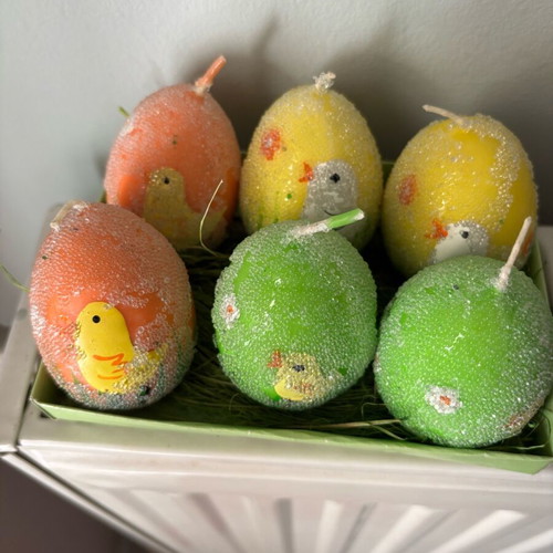 Easter candles shaped like eggs like new, painted