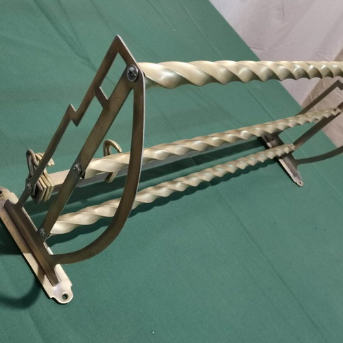 Brass wall-mounted hanger used