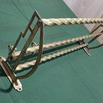 Brass wall-mounted hanger used