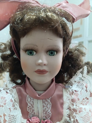 Porcelain doll used with cracked forehead from fall