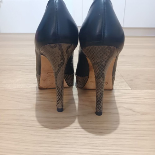 Peep toe heels used, leather with animal print platform