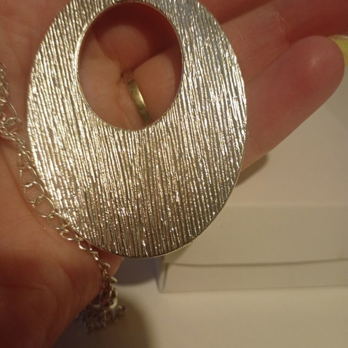 Avon Animal Magnetism pendant new with zebra print