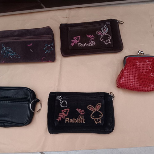 Wallets used, small, multicolored, with non-working zippers