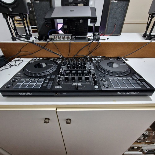 Pioneer DDJ-FLX10 DJ controller used with soft case and music collection