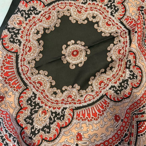 Large square scarf used in green and red