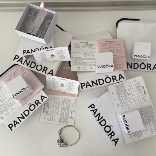 Pandora bracelet and charms like new with certificates
