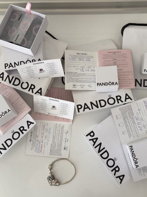 Pandora bracelet and charms like new with certificates