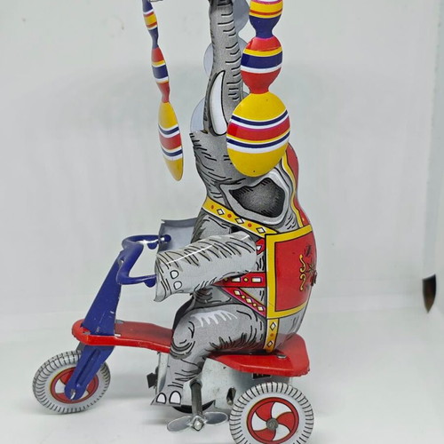 Vintage metal elephant on tricycle like new
