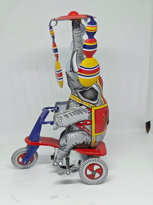 Vintage metal elephant on tricycle like new