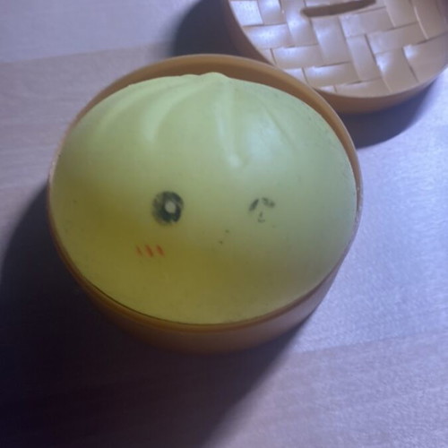 Dumpling yellow stress toy used, eyes slightly faded