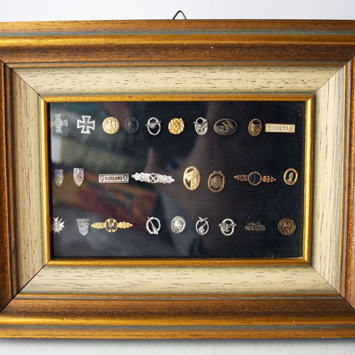 Frame with 27 old German Nazi military badges from World War II like new