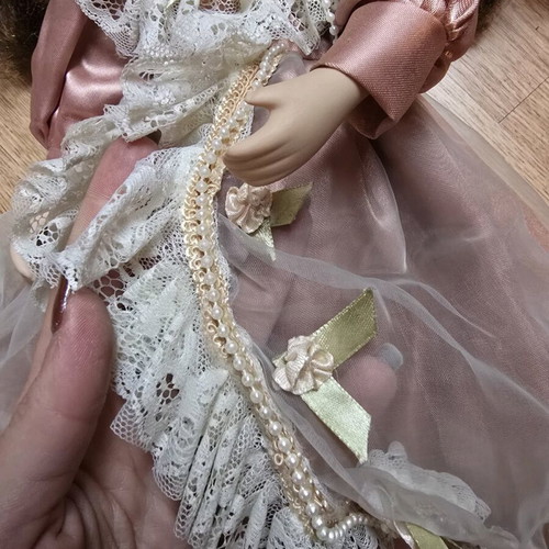 Glass doll like new with satin rotten apple dress and hat