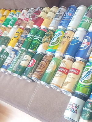 Collection of 77 used empty beer cans from world brands