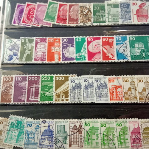 Stamp album with some stamps, mostly cancelled