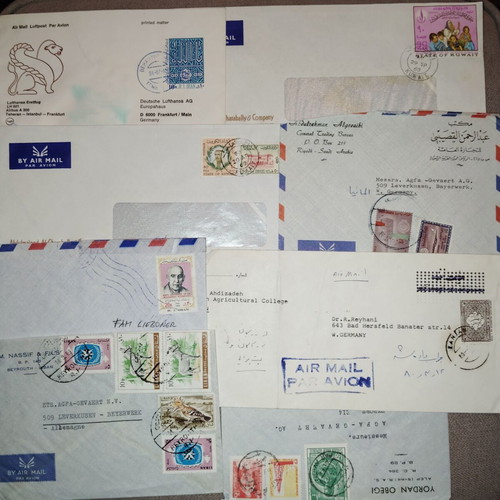 Collection of envelopes and stamps from around the world, new