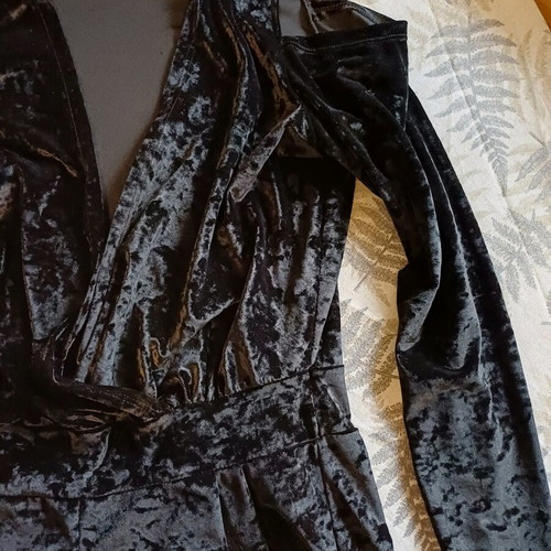 Black velvet jumpsuit like new with deep neckline and off-shoulder design