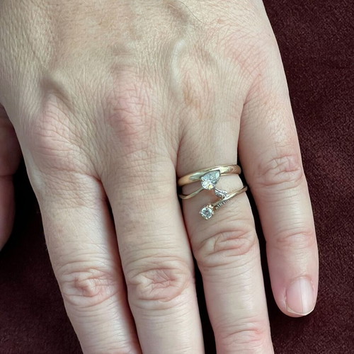 Women's 14K gold ring like new with round cut and pear-shape stones