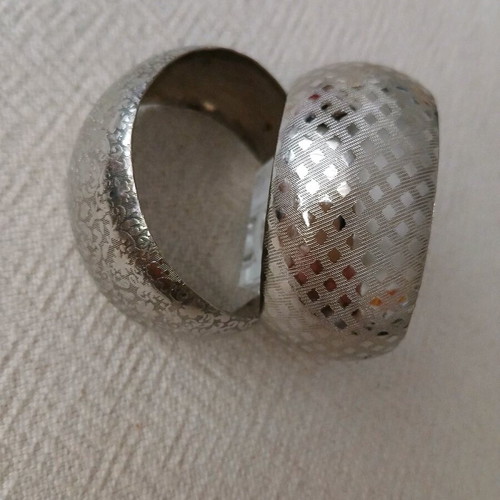 Vintage cuff bracelets like new, embossed geometric and floral design, set of 2