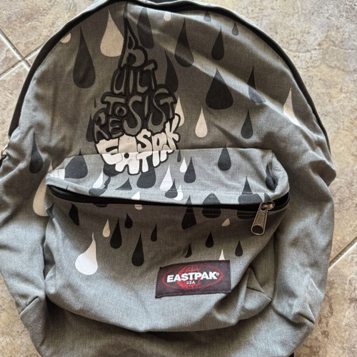 Eastpak backpack used, grey with graffiti design