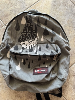 Eastpak backpack used, grey with graffiti design