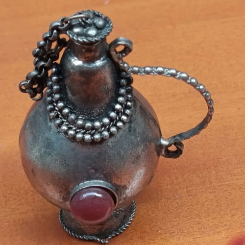 Perfume bottle antique like new, can be chained to necklace