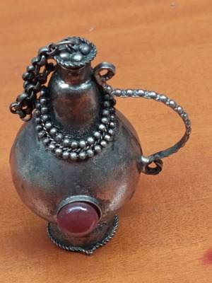 Perfume bottle antique like new, can be chained to necklace