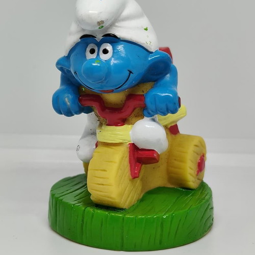 Smurf collectible figure on bicycle handmade Peyo like new