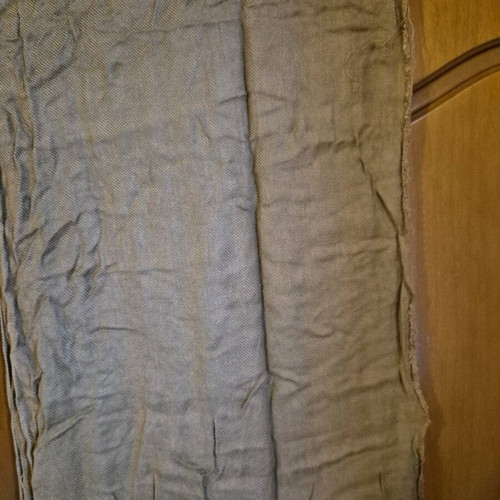Scarf used in brown and beige tones with fringed edges
